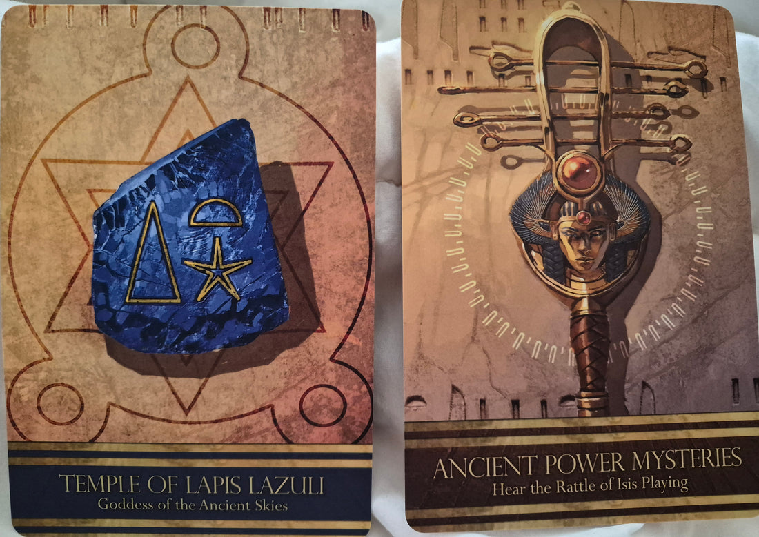 Two Isis oracle cards: Temple of Lapis Lazuli, Goddess of the Ancient Skies, and Ancient Power Mysteries, Hear the Rattle of Isis Playing.