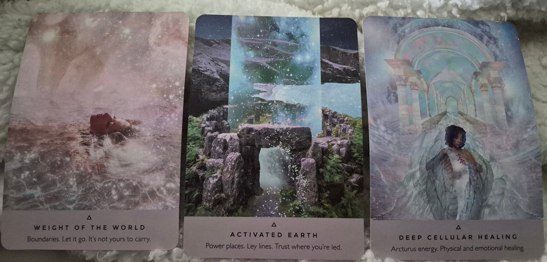 Three oracle cards: Weight of the World, Activated Earth, and Deep Cellular Healing