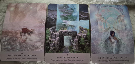 Three oracle cards: Weight of the World, Activated Earth, and Deep Cellular Healing