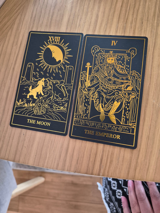 The Moon and The Emperor tarot cards from a daily collective reading