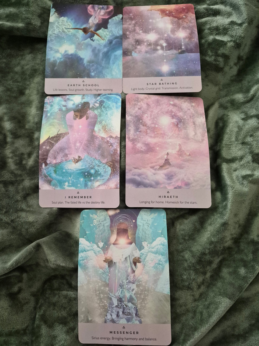 Five oracle cards spread: Earth School, Star Bathing, I Remember, Hiraeth, and Messenger