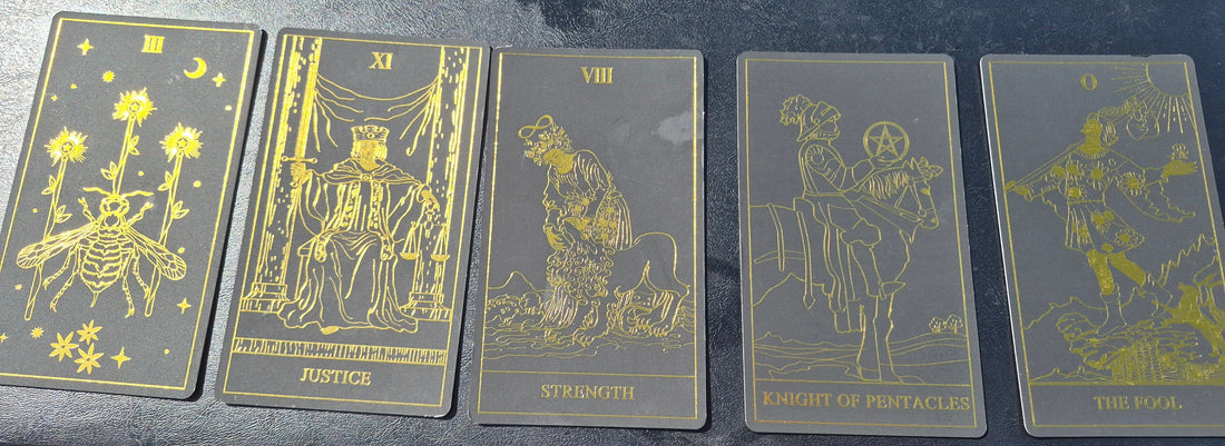 Five tarot cards laid out for the May 19 2026 daily collective reading: Three of Pentacles, Justice, Strength, Knight of Pentacles, and The Fool