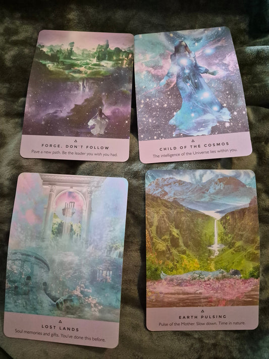 Four oracle cards: Forge Don't Follow, Child of the Cosmos, Lost Lands, and Earth Pulsing