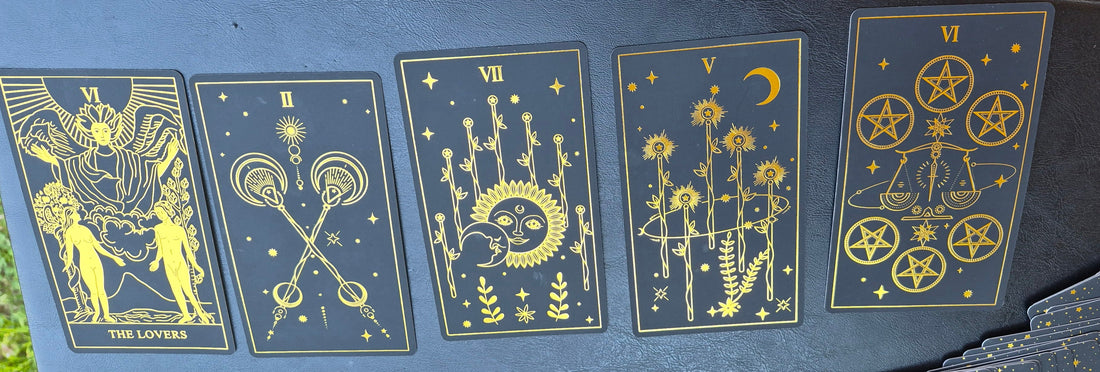 Five tarot cards laid out for the daily collective reading: The Lovers, Two of Wands, Seven of Wands, Five of Wands, and Six of Pentacles