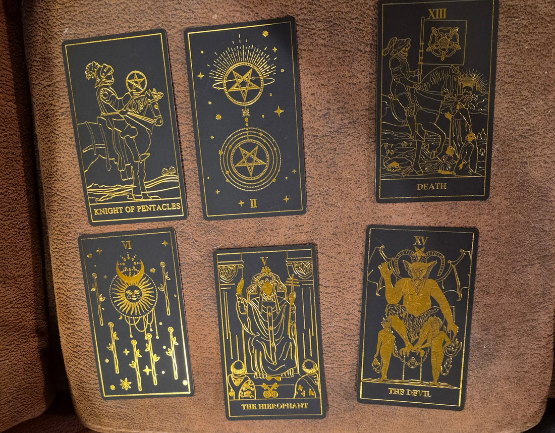 Six tarot cards laid out for the daily collective reading: Knight of Pentacles, II of Pentacles, Death, VI of Wands, The Hierophant, and The Devil