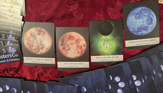 Moon oracle card spread showing Full Moon in Capricorn, Full Moon in Aries, New Moon in Virgo, and Full Moon in Cancer
