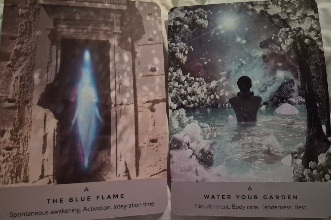 Two oracle cards: The Blue Flame and Water Your Garden